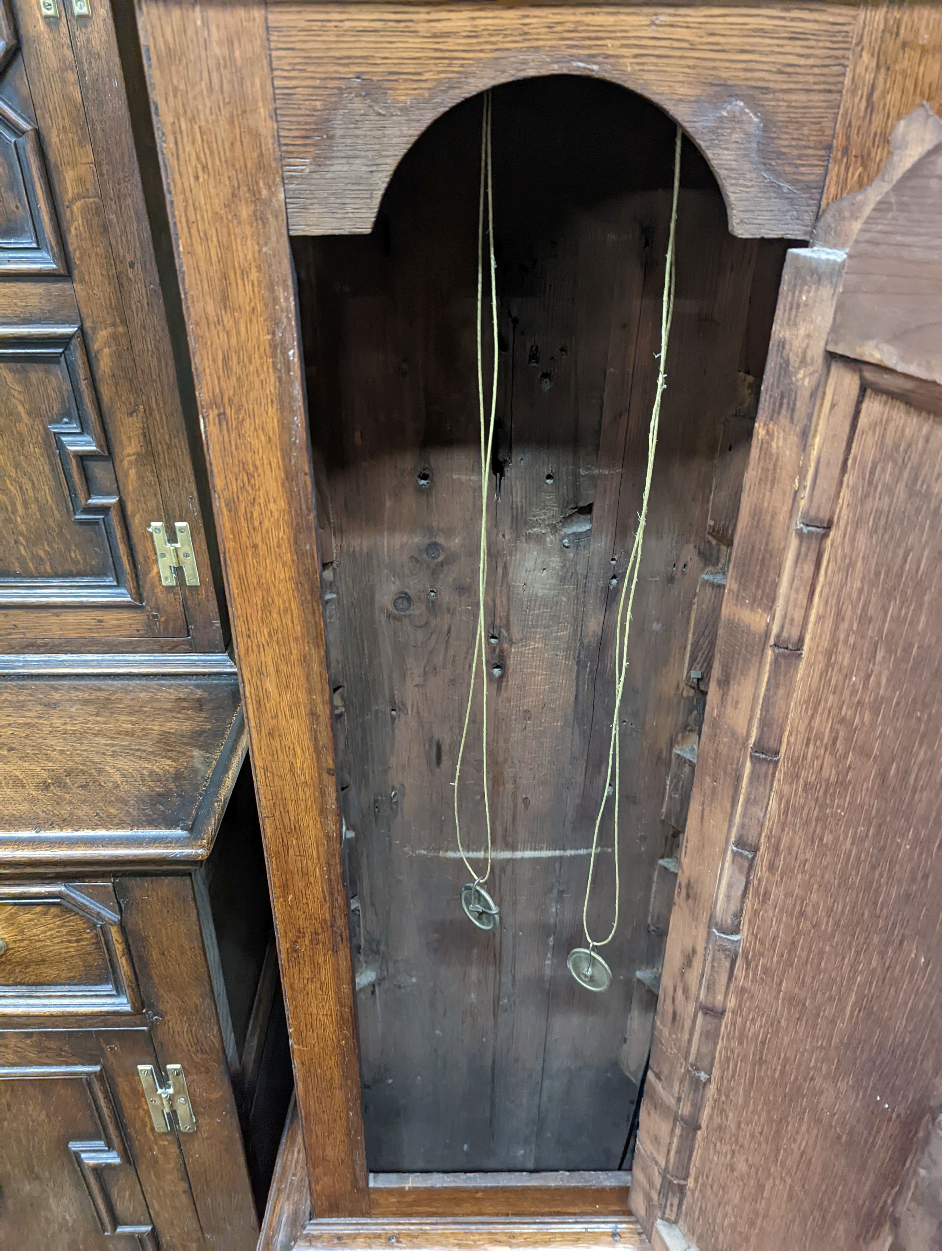 An early 19th century oak eight day longcase clock, the painted dial marked Henry Bunyan, Lincoln, (case in two sections) height 224cm